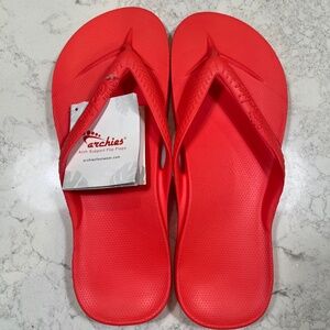 Archie’s Unisex Red Flip Flops, New With Tags. M12/w13. Measure 11.5”
